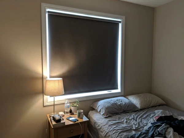 Blackout roller blind with side channels closed in a Kanata Lakes bedroom
