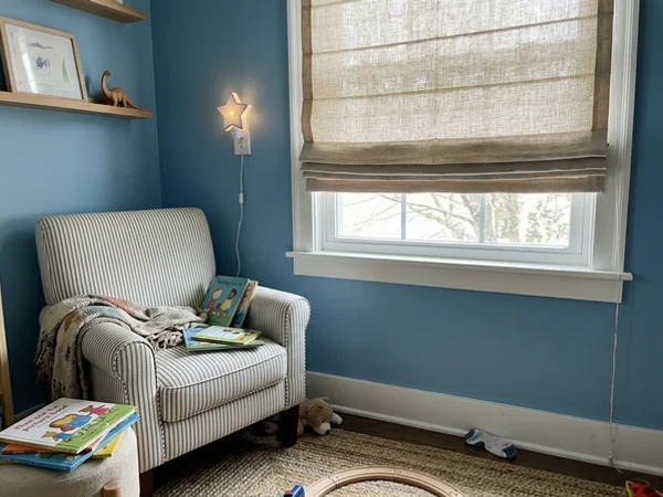 Cordless linen roman shade in a Craig Henry child's bedroom