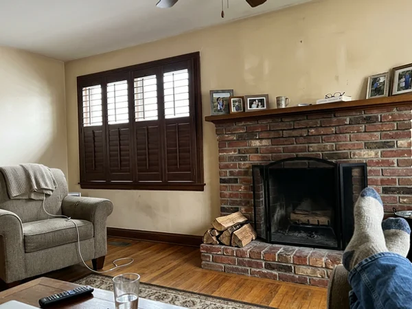 Hidden tilt bar hardwood shutters in a McKellar Park living room