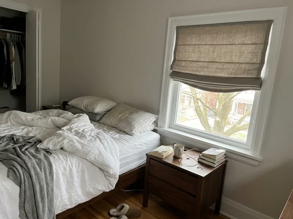 Relaxed fold roman shade in a Westboro Village primary bedroom