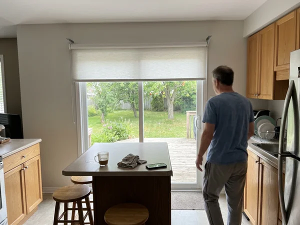 Roller shade on extension brackets clearing a slider handle in Bells Corners