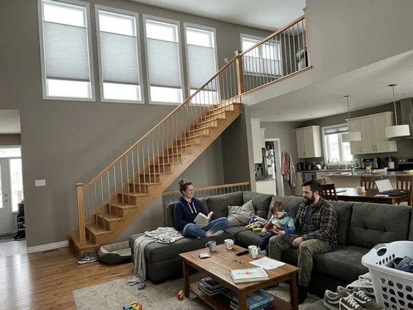 Motorized cellular shades on high transom windows in a Kanata Lakes great room